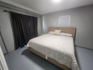 a bedroom with a bed and a window at 349 Avenida Madera in Siesta Key