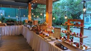 a long table with a bunch of food on it at Camellia Villa Đà Lạt in Xuan An