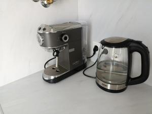 a coffee maker and a blender on a counter at New Energia apartment in center city in Narva