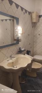 a bathroom with a sink and a mirror at Al Green House in Rome +69 photos