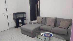 a living room with a couch and a tv at Casa Isabel IUN P9639 in Olbia
