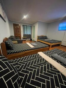 Postel nebo postele na pokoji v ubytování Cama Lodge
