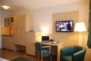 TV a/nebo společenská místnost v ubytování Apartment Hotel Rüther