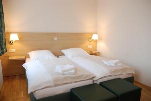 Postel nebo postele na pokoji v ubytování Apartment Hotel Rüther