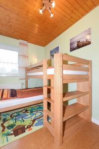 Postel nebo postele na pokoji v ubytování Ferienhaus Blauer Anker