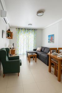 a living room with a couch and a table at Apartment Costa Blanca Cabo Roig in Playas de Orihuela