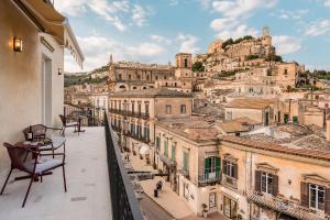 a balcony with a view of the city at Al Monumento in Modica