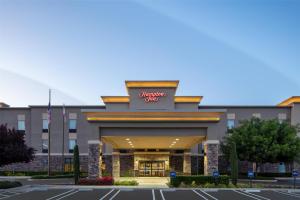 a rendering of the front of a hotel at Hampton Inn by Hilton Turlock in Turlock