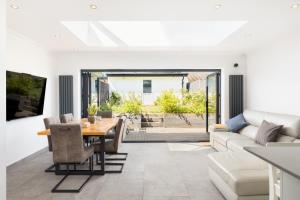 a living room with a table and a couch at Executive Harborne House in Birmingham