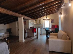 a living room with a couch and a table at Monte Etna Confòrt Maison in Linguaglossa