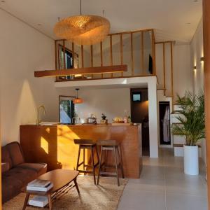 a living room and kitchen with a couch and a table at 월영사계 in Seogwipo