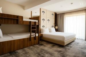a bedroom with two bunk beds and a window at Tryp by Wyndham Istanbul Topkapi in Istanbul +47 photos