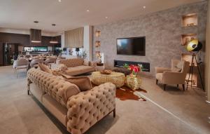 a large living room with couches and a bar at Gorgeous Home In Momjan With Sauna in Momjan