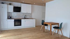 Kuchyň nebo kuchyňský kout v ubytování Ferienwohnung Stern mit Terrasse