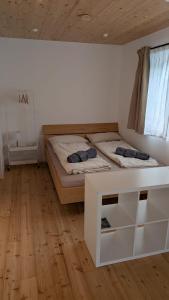 Postel nebo postele na pokoji v ubytování Ferienwohnung Stern mit Terrasse
