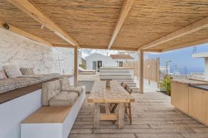 an outdoor patio with a couch and a table at Casa Xuixo in Tenerife South in Guía de Isora