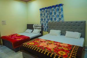 Ένα ή περισσότερα κρεβάτια σε δωμάτιο στο Heramb pg house