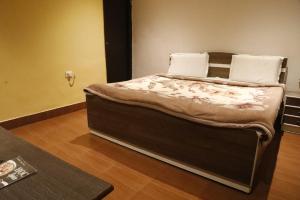 Postel nebo postele na pokoji v ubytování Hotel Om Complex