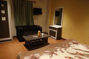 TV a/nebo společenská místnost v ubytování Hotel Om Complex