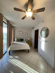 a bedroom with a bed and a ceiling fan at Suite Condominios Posada frente al mar, San Carlos Reservaciones 212 in San Carlos +9 photos