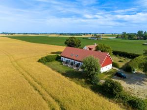 an aerial view of a house in the middle of a field at Glivarpagården in Hammenhög