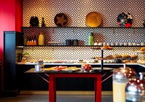 a table with plates of food on top at ProfilHotels Copenhagen Plaza in Copenhagen