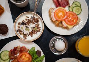 a group of plates of food on a table at ProfilHotels Copenhagen Plaza in Copenhagen
