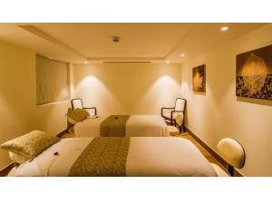 Voodi või voodid majutusasutuse Vivanta Bengaluru Residency Road toas