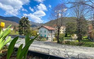 a view of a street with houses and mountains at 2 Bedroom Cozy Apartment In Montoggio in Montoggio +15 photos