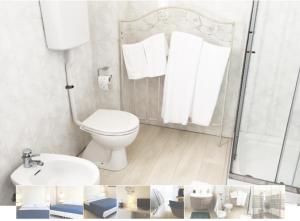 a bathroom with a toilet and a sink and a shower at Ai Binari in Giulianova