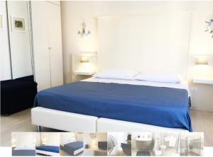 a bedroom with a bed with a blue bedspread at Ai Binari in Giulianova