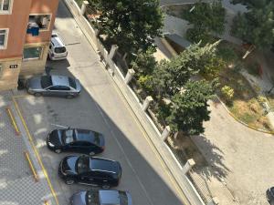 an overhead view of cars parked in a parking lot at Kvartira s vidom na more in Sumqayyt +1 photo