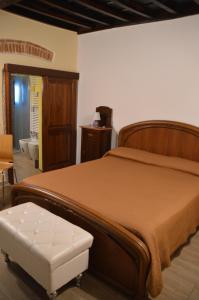 Ένα ή περισσότερα κρεβάτια σε δωμάτιο στο borgo di Carlotta