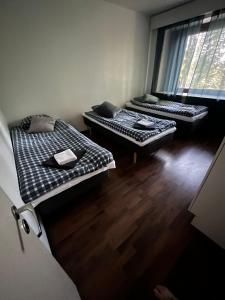Giường trong phòng chung tại Luxury City Apartments, Ounasvaara