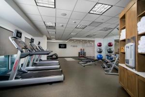 a gym with treadmills and machines in a room at Fairfield Inn & Suites Fort Worth Downtown/Convention Center in Fort Worth
