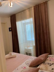 Ein Bett oder Betten in einem Zimmer der Unterkunft Apartman Sana