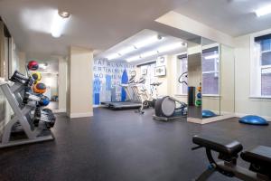 a gym with several exercise equipment in a room at Ellis Hotel, Atlanta, a Tribute Portfolio Hotel in Atlanta