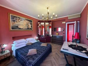 a bedroom with a bed and a desk in it at Isoco House in Taormina +94 photos