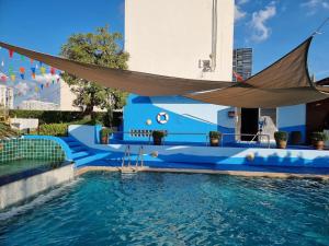 a hammock hanging over a swimming pool at Civic Park in Bangkok