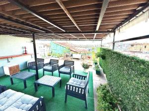 a group of chairs and tables on a patio at Taksim Amur Mansion Hotel in Istanbul