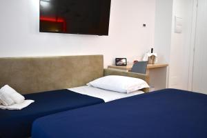 Postel nebo postele na pokoji v ubytování BAJAMAR BEACH HOTEL