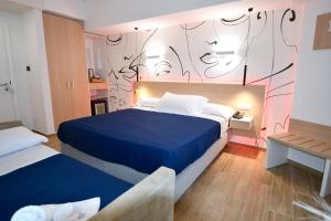 Postel nebo postele na pokoji v ubytování BAJAMAR BEACH HOTEL