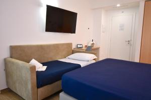 Postel nebo postele na pokoji v ubytování BAJAMAR BEACH HOTEL