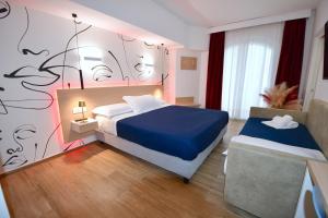 Postel nebo postele na pokoji v ubytování BAJAMAR BEACH HOTEL