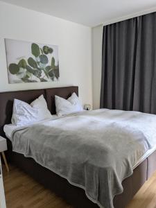 Postel nebo postele na pokoji v ubytování Apartments Nassfeldpass