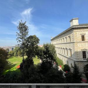 a large white building with a green field in front of it at Miapera Hotel & Spa - Special Class in Istanbul