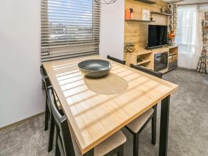 a kitchen with a wooden table with a bowl on it at Long View Lodge in Felton