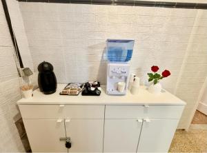 a white cabinet with a blender on top of it at Rooms La Laja 1 in Las Palmas de Gran Canaria