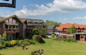 a group of houses in a yard with grass at 1-Raum Appartement mit Terrasse in Plau am See