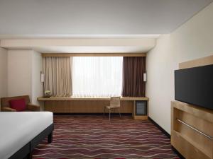 ibis Kuwait Salmiya的电视和/或娱乐中心